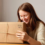 The Power of Personal Connection**
A delighted customer in a cozy, modern German home environment, happily unboxing a modest package from an online low-cost retailer. The customer's face shows genuine surprise and joy as they discover a small, unexpected, personalized touch inside – like a neatly handwritten thank-you note or a thoughtful, small bonus item. The scene emphasizes the emotional impact of feeling valued and seen, transcending the low price point. Soft, inviting lighting, reflecting warmth and appreciation.

**
